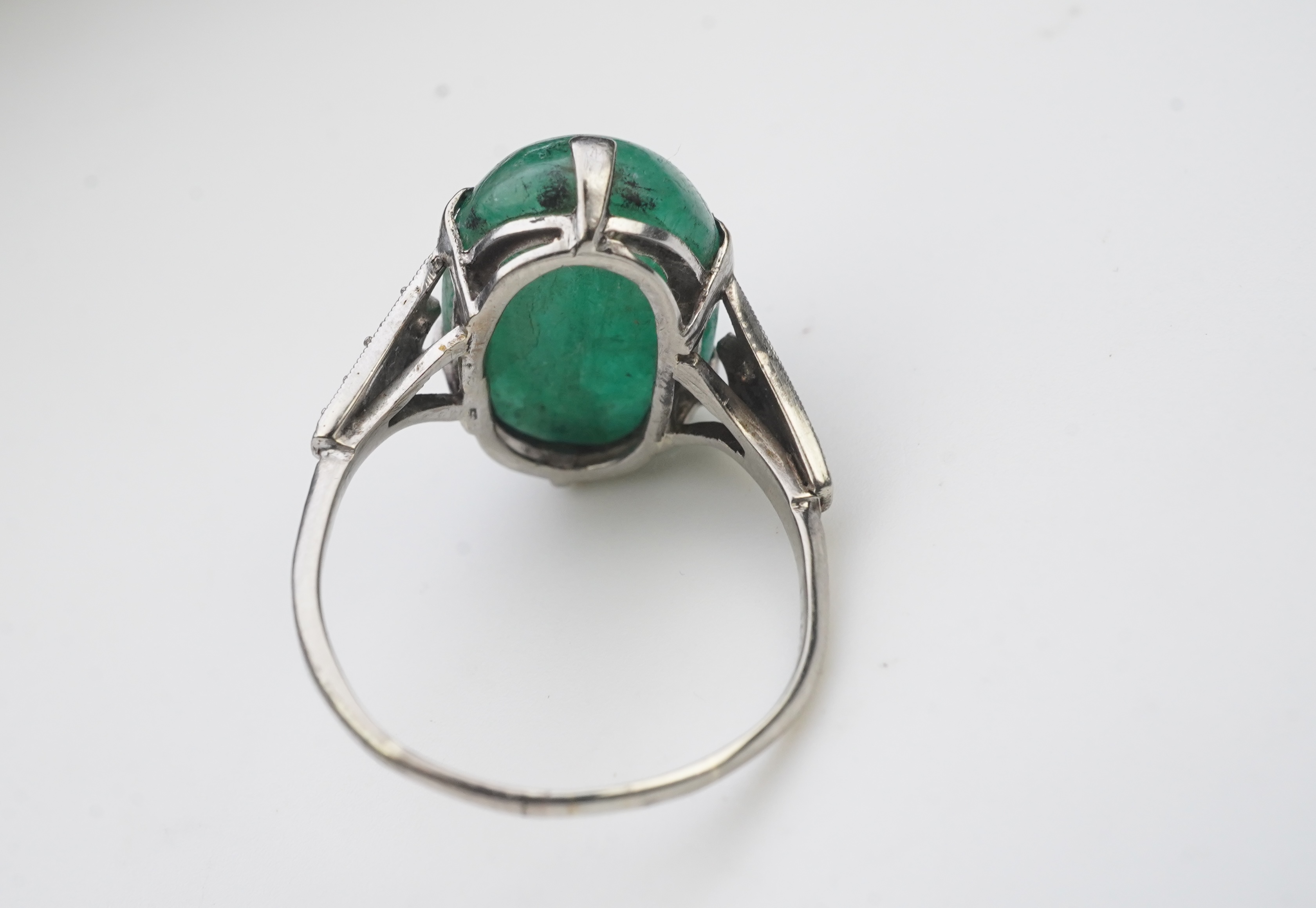 An emerald and diamond ring, early 20th century